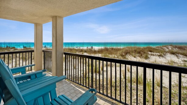 A balcony with a view of the beach and ocean. - π 3BR/3BA π Ground Floor @ Pinnacle Port βοΈ π 50 π©΄π©΄ to the sand (Panama City Beach)