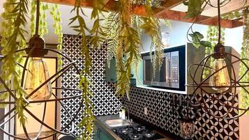 Fridge, microwave, coffee/tea maker, cookware/dishes/utensils