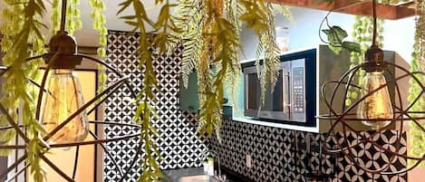 Fridge, microwave, coffee/tea maker, cookware/dishes/utensils