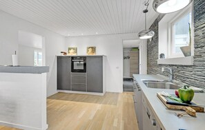 Fridge, stovetop, dishwasher, coffee/tea maker