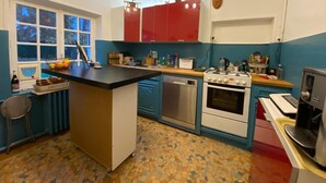 A kitchen with a central island, a dishwasher, a stove, and a coffee machine. - RIVERSIDE CHARACTER HOUSE WITH OUTBUILDING (Ménilles)