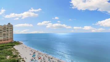 On the beach, sun loungers, beach towels