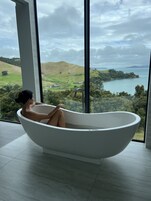 Villa Joy | Bathroom | Separate tub and shower, deep soaking tub, hair dryer, bathrobes