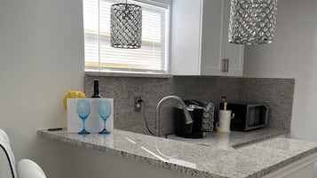 Fridge, microwave, coffee/tea maker, toaster