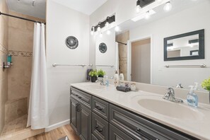 Combined shower/tub, hair dryer, towels, soap