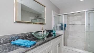 Bathtub, hair dryer, towels, soap