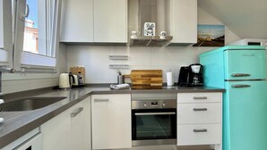 A modern kitchen with a built-in oven, a coffee maker, and a vintage refrigerator. - T-0721, Havanna, villa in Mimosa II with 3 bedrooms (Els Poblets)