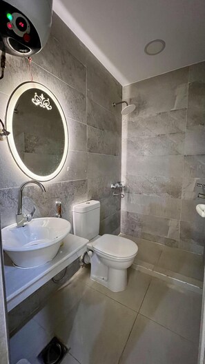 Hair dryer, slippers, bidet, towels