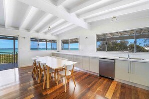 Enjoy ocean views from the kitchen window, where a central island and dishwasher make meal prep a breeze.