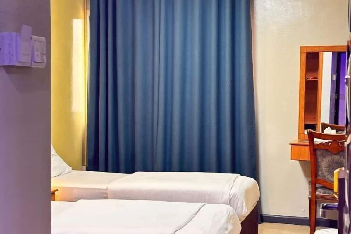 Minibar, iron/ironing board (on request), WiFi (free), bed sheets