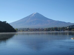 A lake with a mountain in the background.