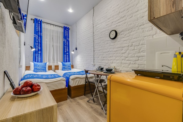 Quarto duplo superior | 1 quarto, ferros/tábuas de passar roupa, Wi-Fi de cortesia