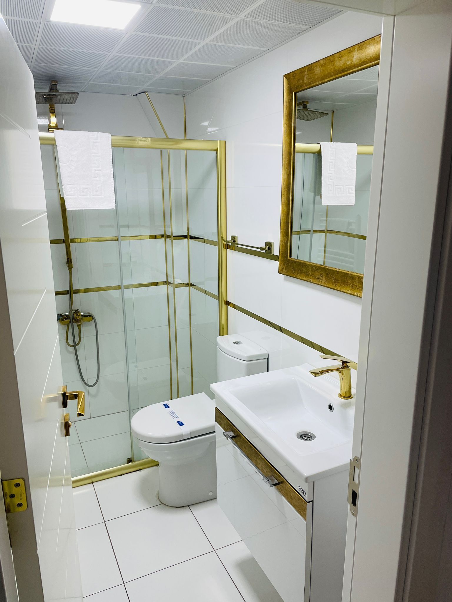 city suite | bathroom | shower, rainfall showerhead, hair dryer, towels