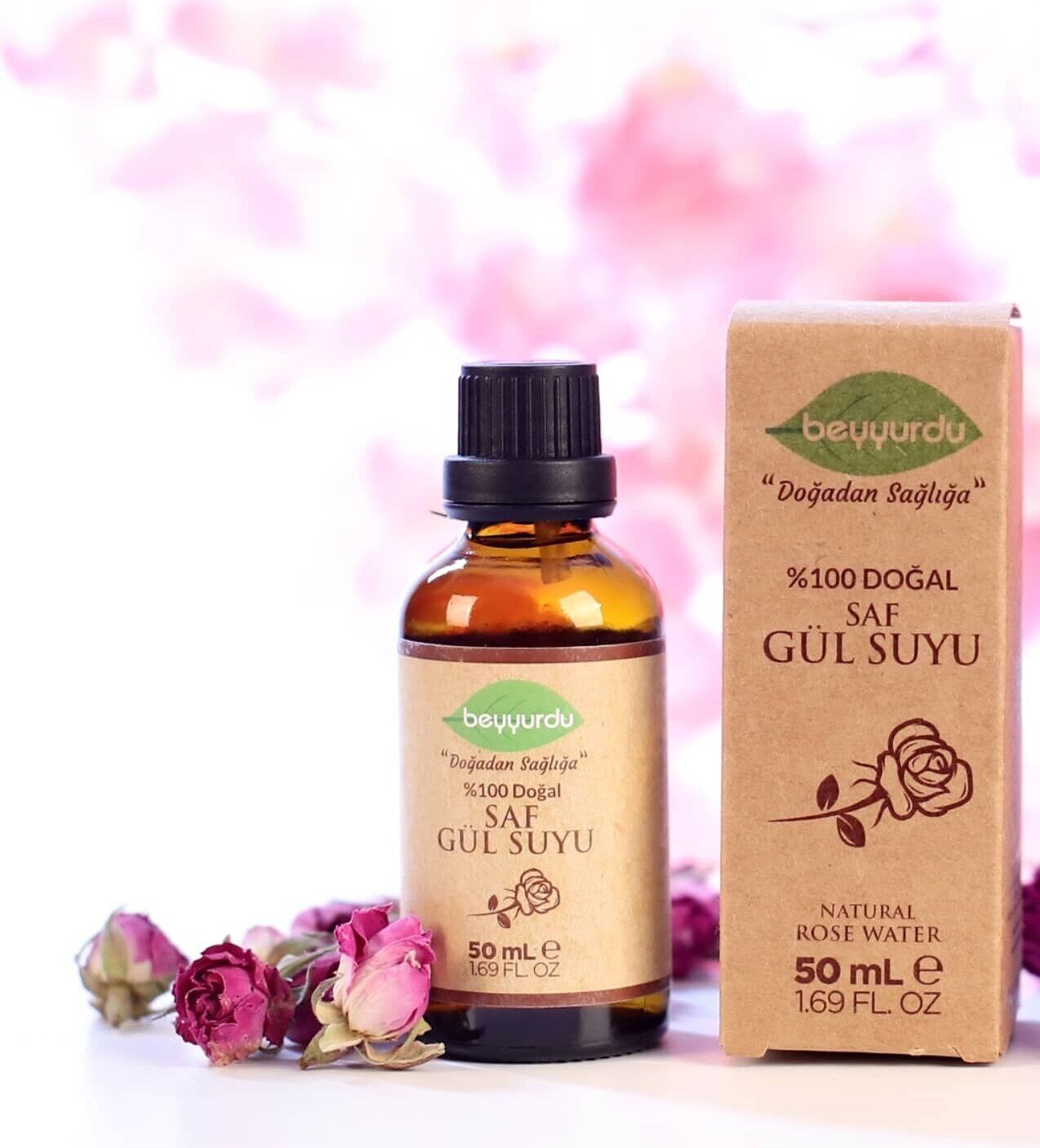 A bottle of natural rose water next to its packaging, with a label indicating it is 50 mL.