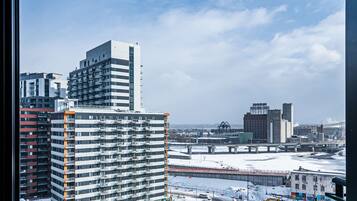 A high-rise building with multiple balconies and a modern architectural design.