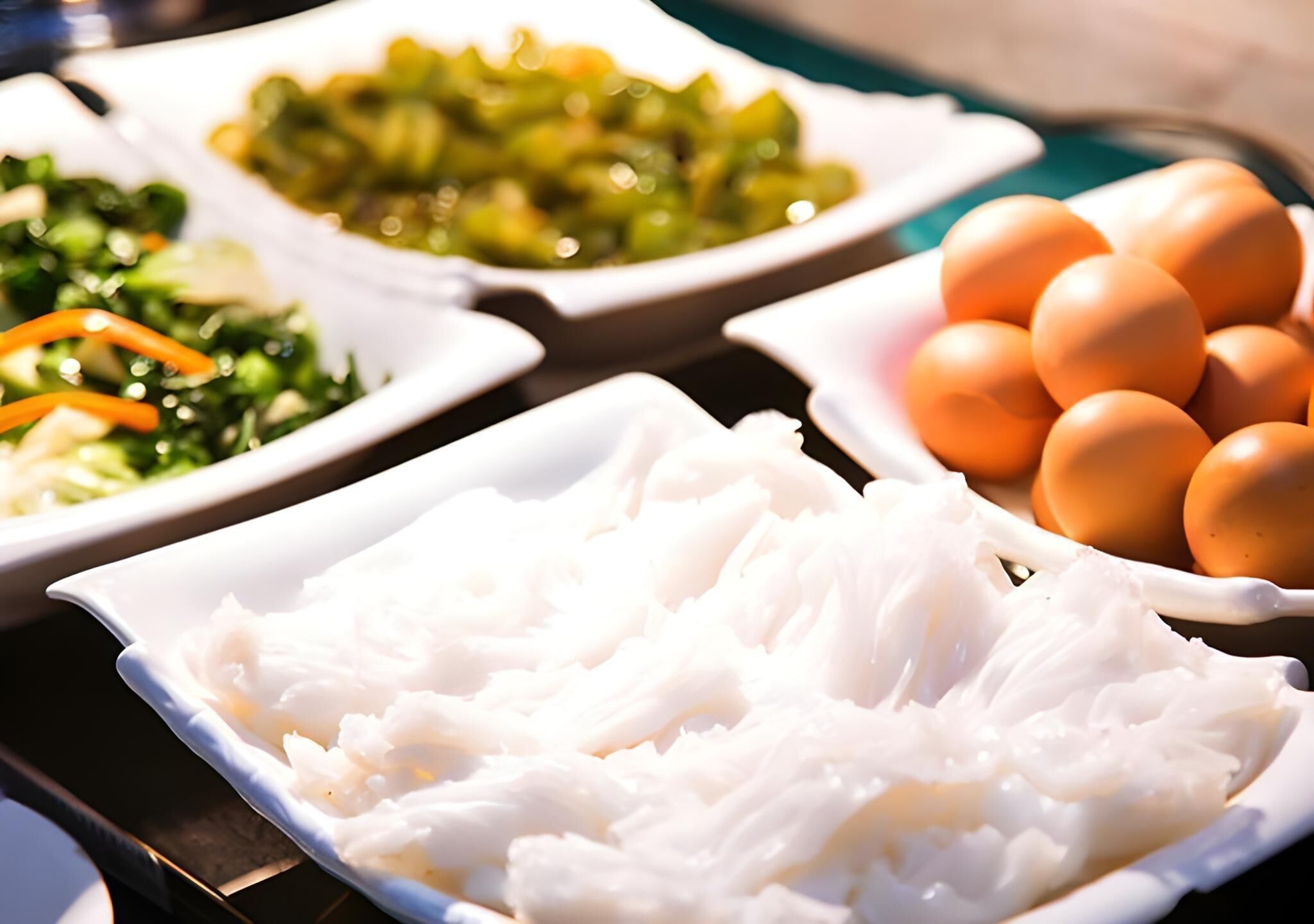 A buffet with various dishes including rice, vegetables, and eggs.
