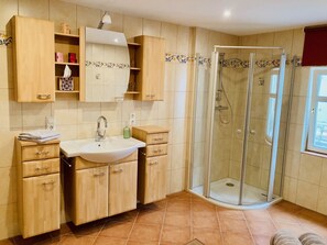 Bathtub, hair dryer, towels, soap