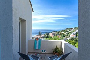 Apartamento familiar, patio, vistas al mar | Terraza o patio