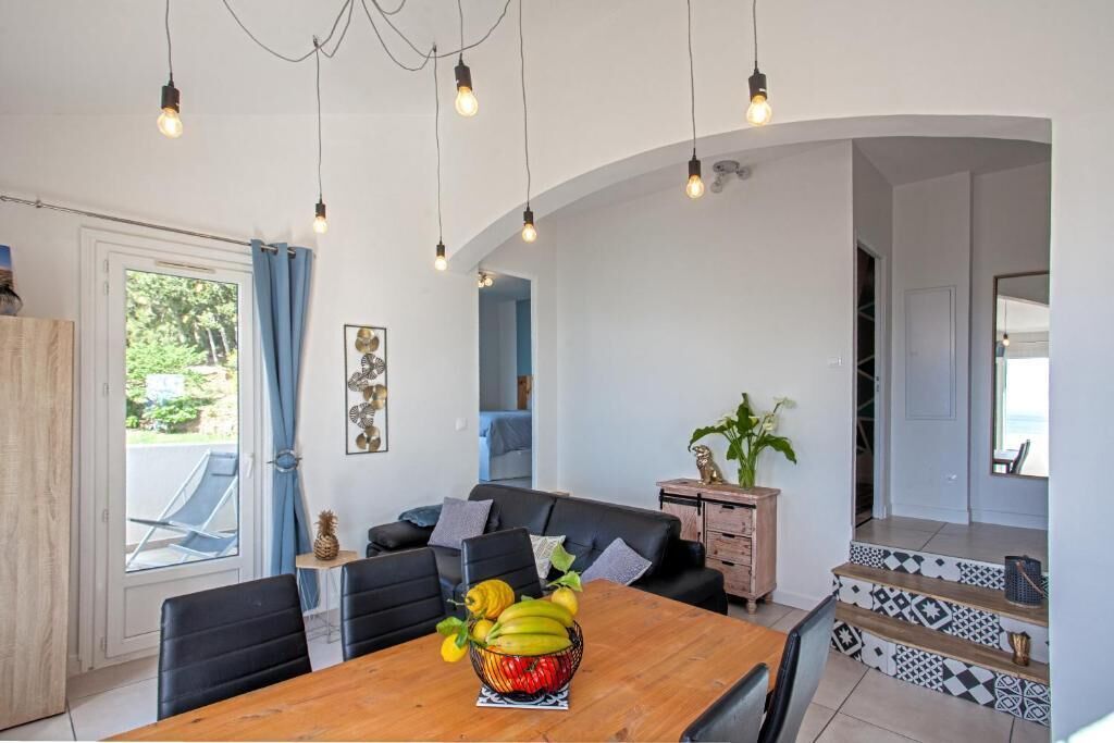 Family Apartment, Patio, Sea View | Living area | TV, books