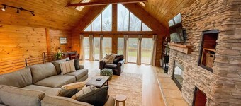 Bring family and friends to this beautiful, spacious, open plan log home. 