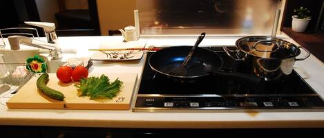Fridge, microwave, stovetop, cookware/dishes/utensils