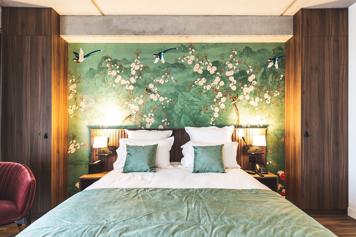 Premium bedding, desk, laptop workspace, soundproofing