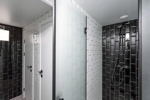 Shower, hair dryer, slippers, towels
