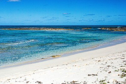 Modern Condo a few steps from sandy beach and resorts