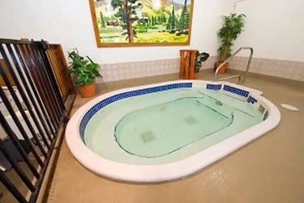 Relax by the indoor pool, surrounded by a serene atmosphere.