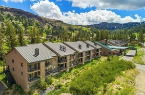 Experience serene mountain views from the hotel's spacious balconies, overlooking lush greenery and trees.