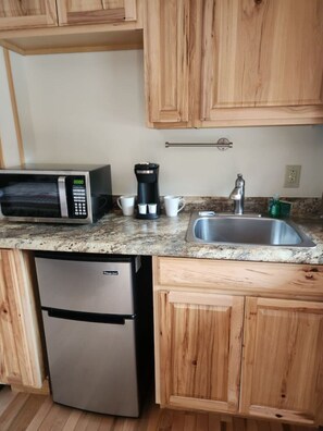 Microwave, stovetop, coffee/tea maker, toaster