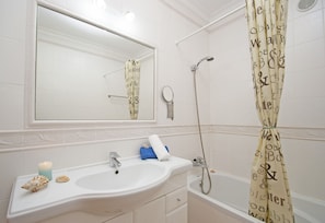 Bathtub, hair dryer, towels
