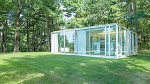 A modern glass structure in a forested area. - Modern Glass House designed by renowned architect Thomas Phifer (Hudson)