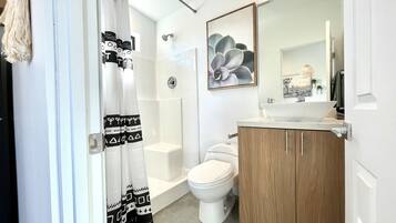 Combined shower/tub, hair dryer, towels, toilet paper