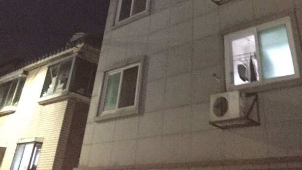 A multi-story building with several windows and air conditioning units. - One bedroom near Ansan Station (Ansanshi)
