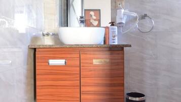 Bathtub, hair dryer, bidet, towels