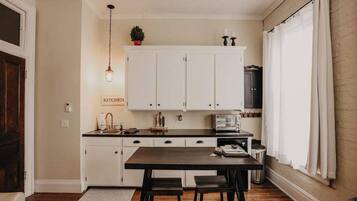 Microwave, stovetop, coffee/tea maker, cookware/dishes/utensils