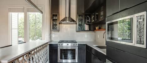 Microwave, dishwasher, coffee/tea maker, cookware/dishes/utensils