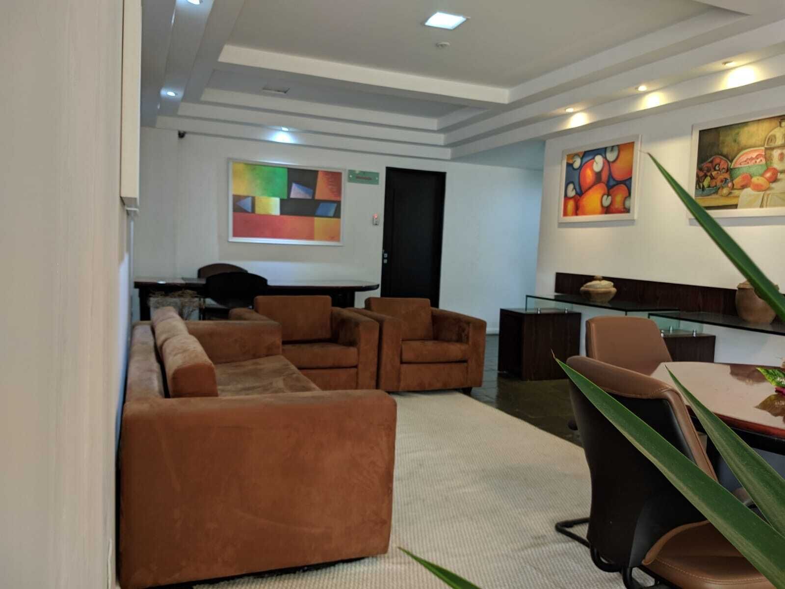 A modern living room with a sectional sofa, armchairs, and a dining area with a glass table.