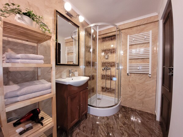 Shower, hair dryer, towels, soap