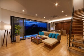 Elite Villa | Living area | 50-inch LCD TV with digital channels, TV - E-horizon Resort Premium SESOKO A (Motobu)