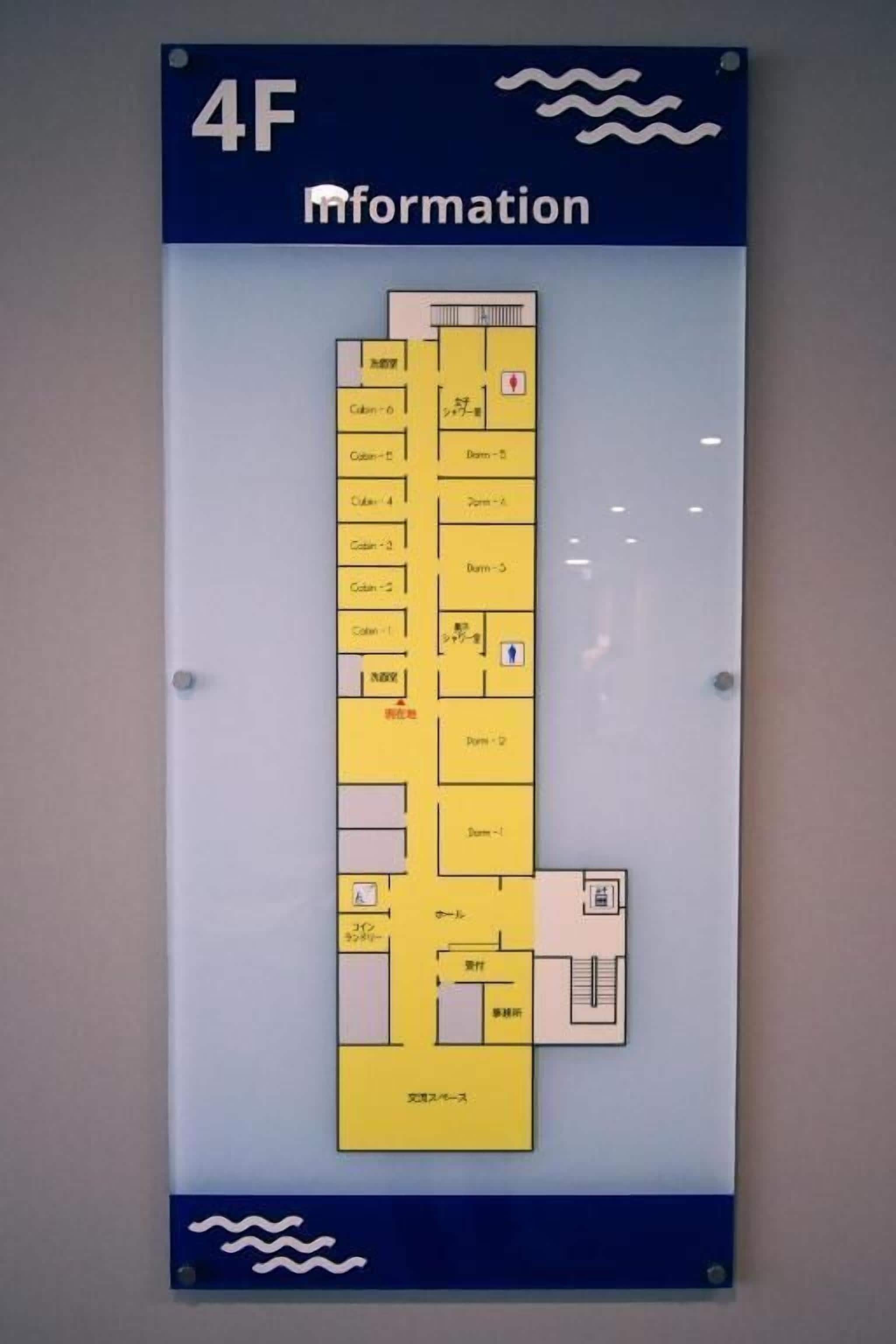 A floor plan with labeled rooms and amenities, including a reception area, restrooms, and a dining area.