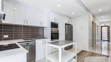 Family Apartment | Private kitchen | Full-size fridge, microwave, oven, stovetop