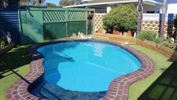 Outdoor pool, open 7:00 AM to 9:00 PM, pool umbrellas, sun loungers