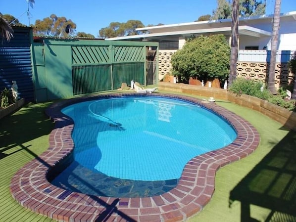 Outdoor pool, open 7:00 AM to 9:00 PM, pool umbrellas, pool loungers