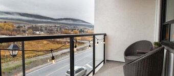 Lake Okanagan beach condo w/ private buoy, AC, heated outdoor pool, patio, SUPs