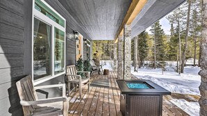 A wooden deck with outdoor seating and a hot tub. - 1 Mi to St Mary’s Glacier Trail: Modern Mtn Cabin! (Idaho Springs)