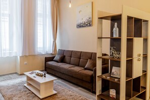 Bohemian Studio | Living area | 60-cm TV with cable channels