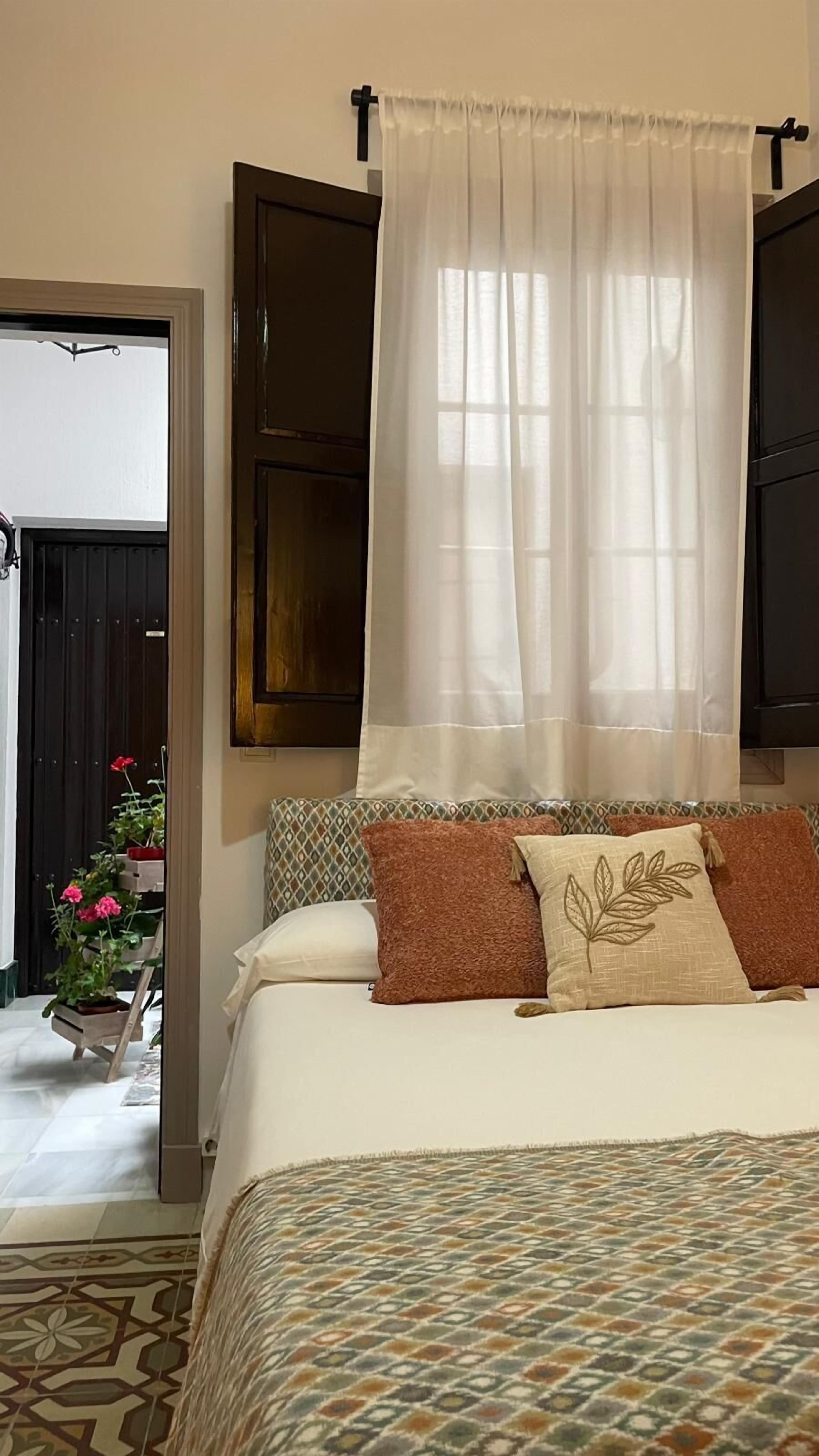 Economy Room | Down comforters, in-room safe, individually decorated