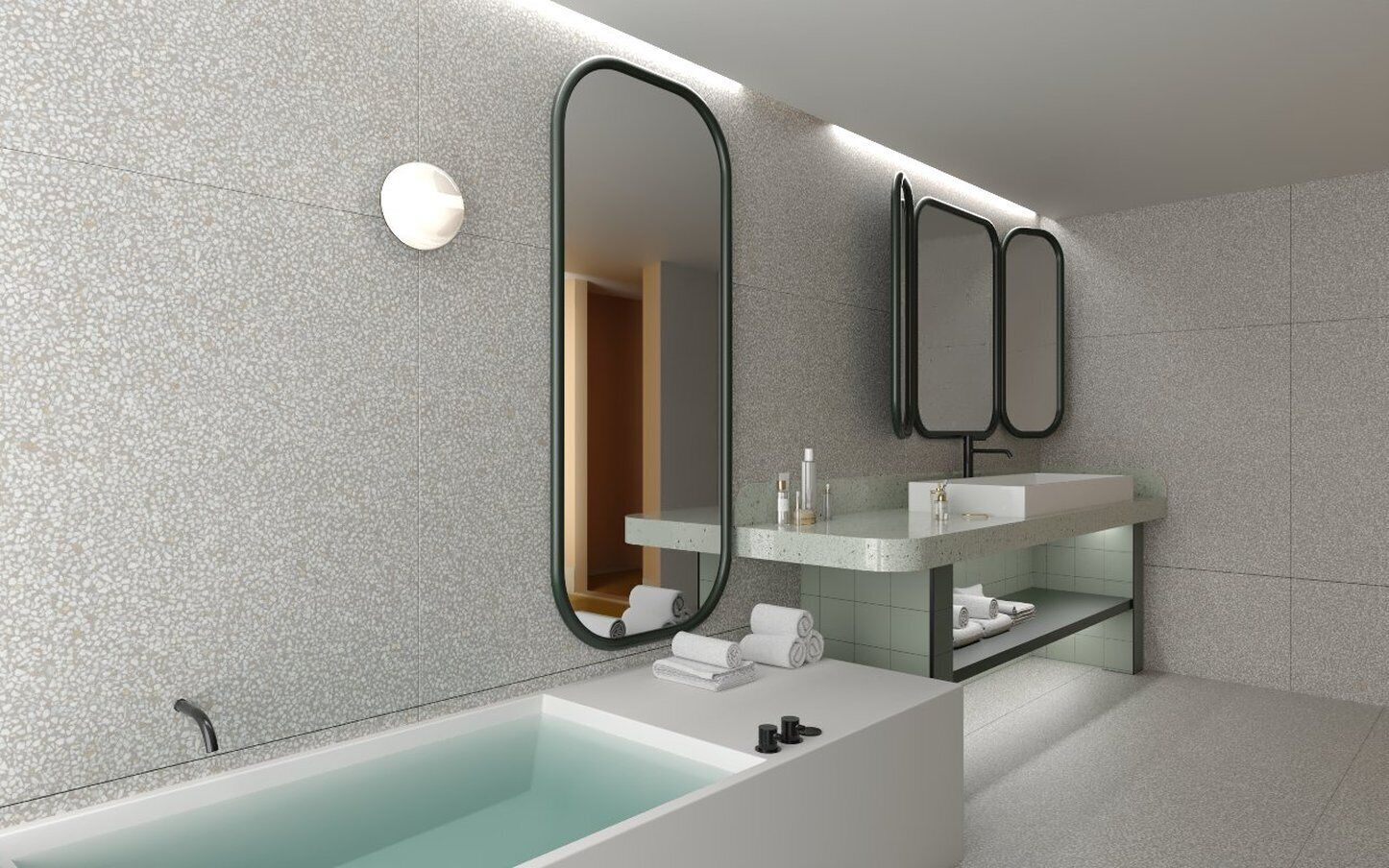 Une salle de bain moderne avec une baignoire sur pieds, un meuble-lavabo avec un miroir et un porte-serviettes.